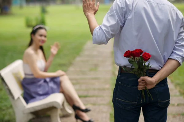 Hiding bouquet of flowers — Stock Photo, Image