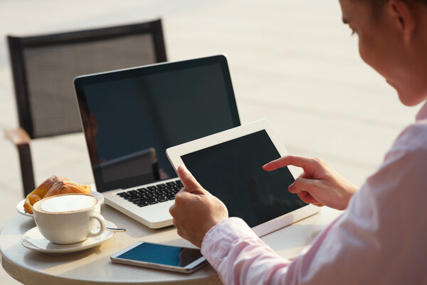 Businessman using various devices