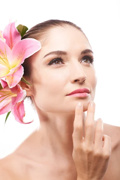 Girl with lilies in hair — Stock Photo, Image