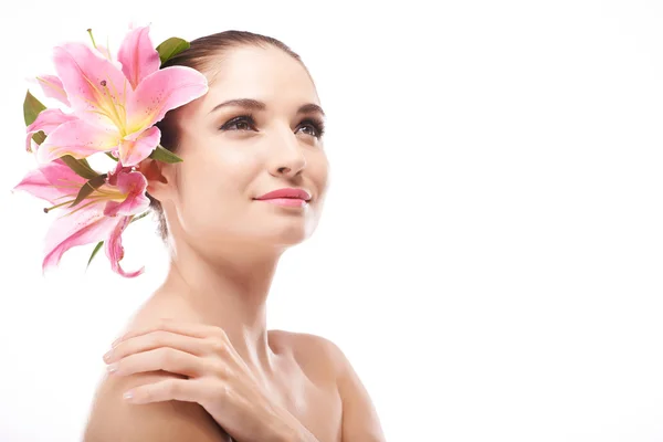 Girl with lilies in hair — Stock Photo, Image