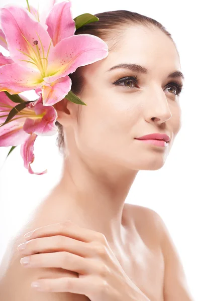Girl with lilies in hair — Stock Photo, Image