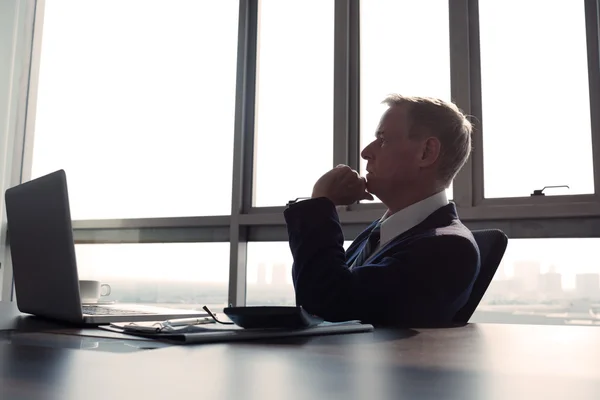 Contemplating businessman in the office, — Stock Photo, Image