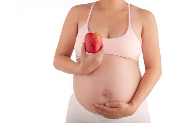 Terhes nő, egy piros Alma — Stock Fotó
