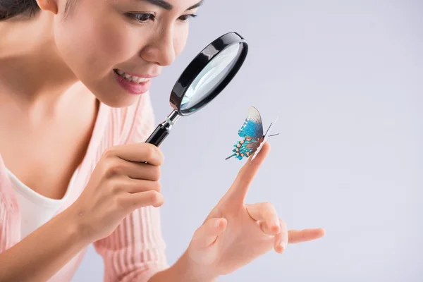 Girl with magnifier — Stock Photo, Image