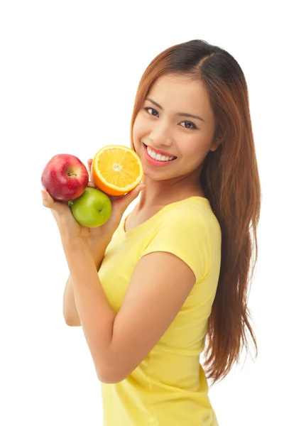 Девушка с различными фруктами — стоковое фото