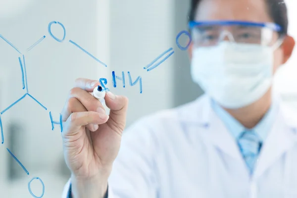 Scientist drawing a molecule — Stock Photo, Image