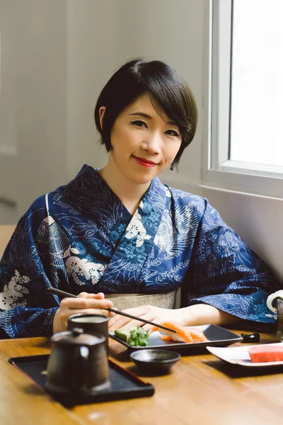 Japanese  woman enjoying traditional food — Stock Photo, Image