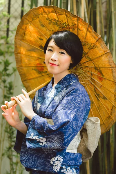 Japanese woman with umbrella — Stock Photo, Image