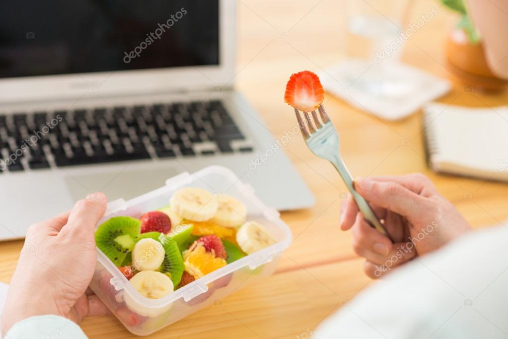 Man eating fruit salad