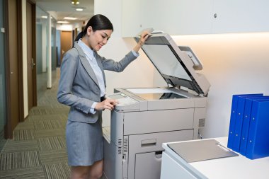 Secretary scanning a document clipart