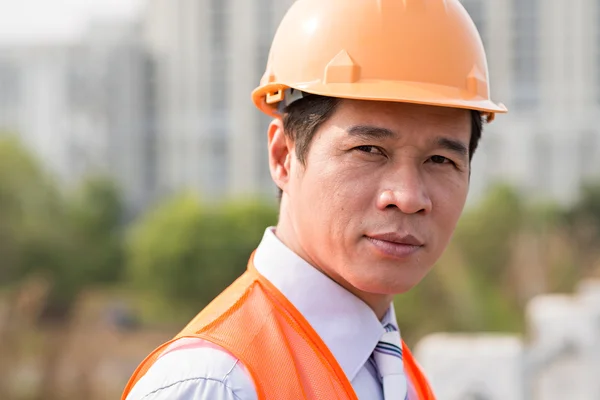 Foreman wearing orange hardhat — Stock Photo, Image