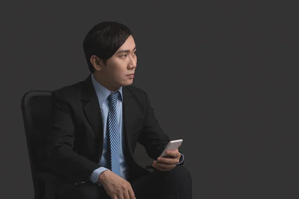 Asian manager using smartphone — Stock Photo, Image