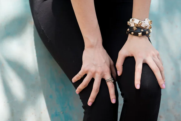 Female hands on her legs — Stock Photo, Image