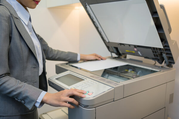 Female manager using copier
