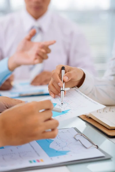 Hands pointing at the business document — Stock Photo, Image