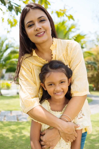 Mother embracing daughter — Stock Photo, Image