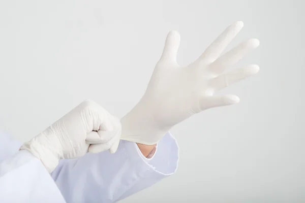 Surgeon Wearing rubber gloves — Stock Photo, Image