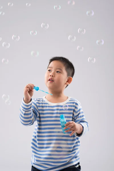 Playing with soap bubbles — Stock Photo, Image