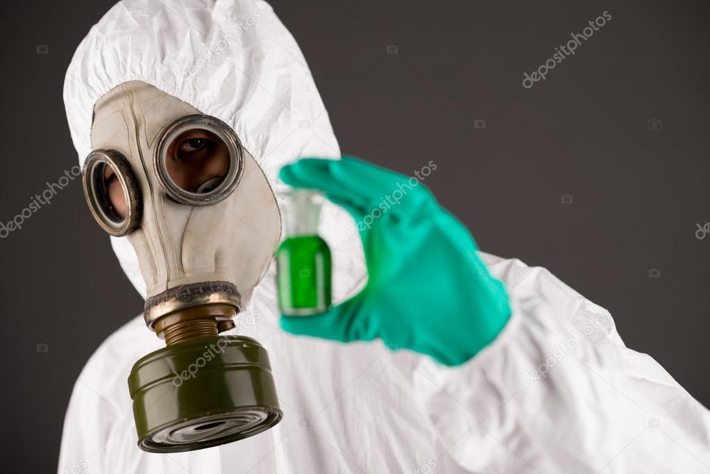 Man in respirator and protective clothing