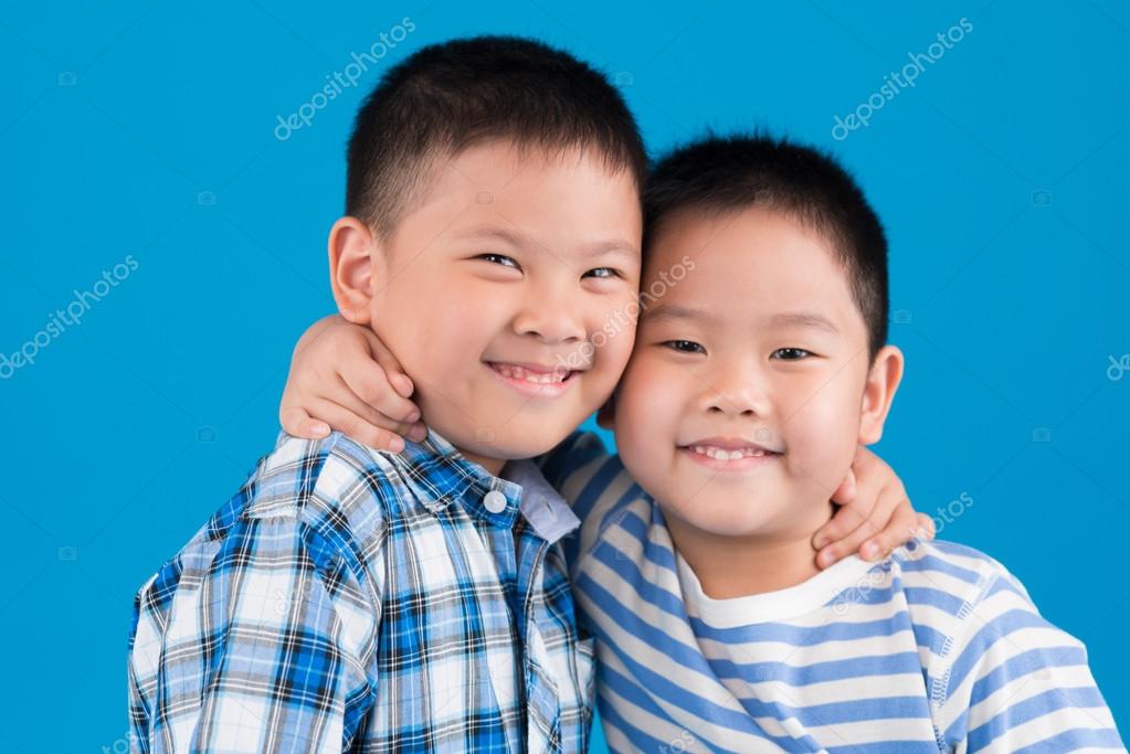 Cheerful Hugging brothers Stock Photo by ©DragonImages 72199655