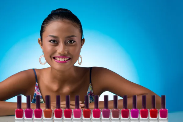 Woman with colorful nail polishes — Stock Photo, Image