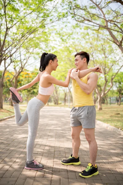 Couple warming-up together — Stock Photo, Image