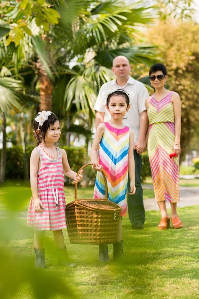 Mixed-race family in park — Stock Photo, Image