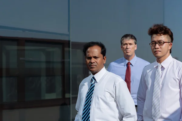 Serious team of businessmen — Stock Photo, Image