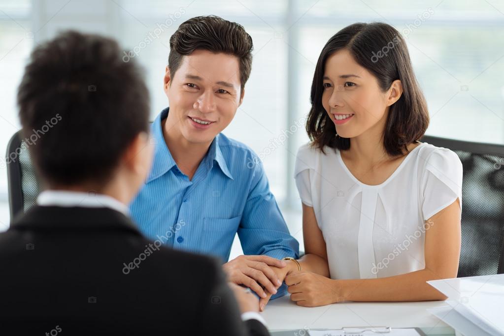 couple  with real estate agent