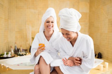 Women together in spa center clipart