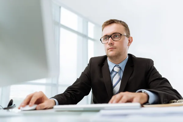 Businessman  over computer monitor — Stock Photo, Image