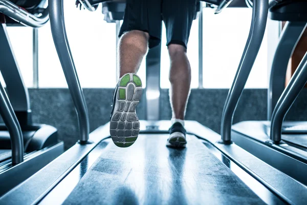 Sportsman running on treadmill — Stock Photo, Image