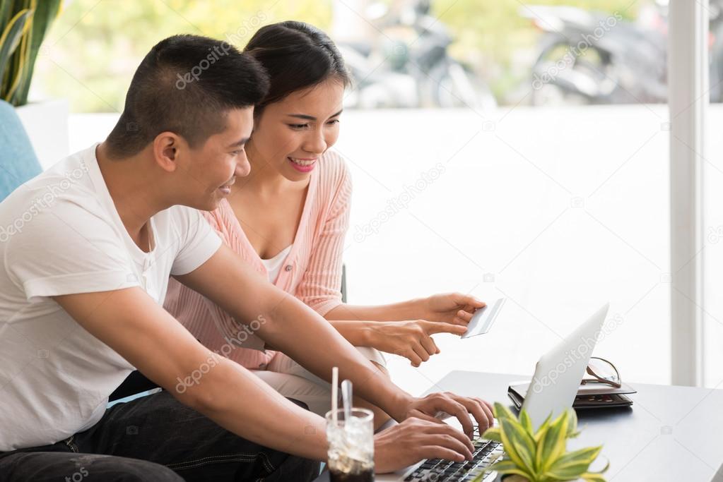 couple with  credit card