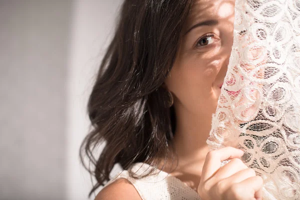 Woman behind the curtain — Stock Photo, Image