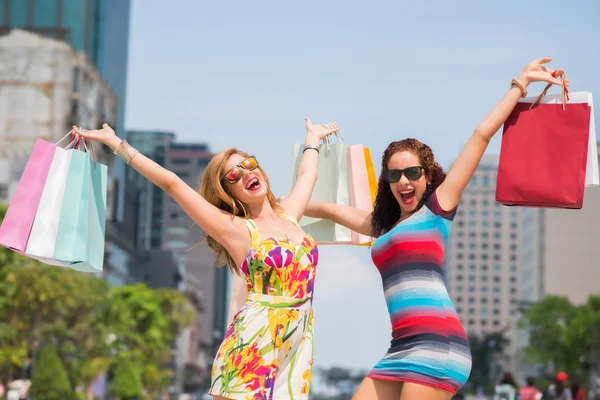 Excited women with shopping bags — Stock Photo, Image