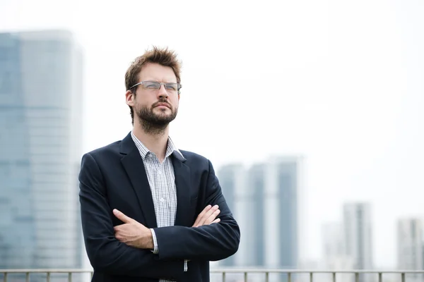 Businessman standing outdoors — Stock Photo, Image