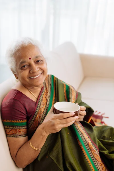 Woman with mug of tea — Stock Photo, Image