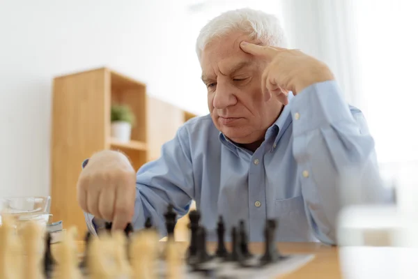 Man thinking over his move in chess — Stock Photo, Image