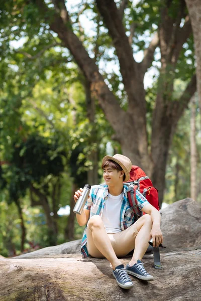 Traveller drinking tea from the thermos — Stock Photo, Image