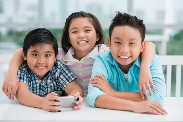 Joyful Asian schoolchildren — Stock Photo, Image