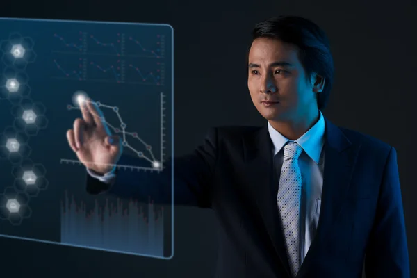 Entrepreneur analyzing futuristic chart — Stock Photo, Image