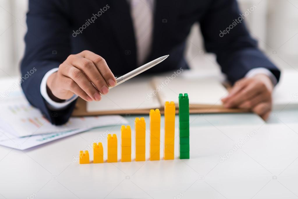 businessman showing column chart