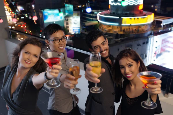 Cheerful friends at the rooftop party — Stock Photo, Image
