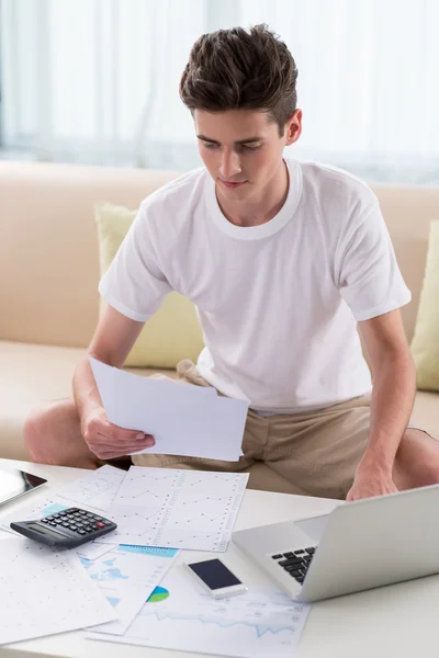 Man examining business documents — Stock Photo, Image