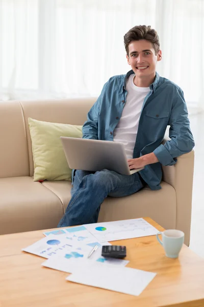 Handsome young man with laptop — Stock Photo, Image