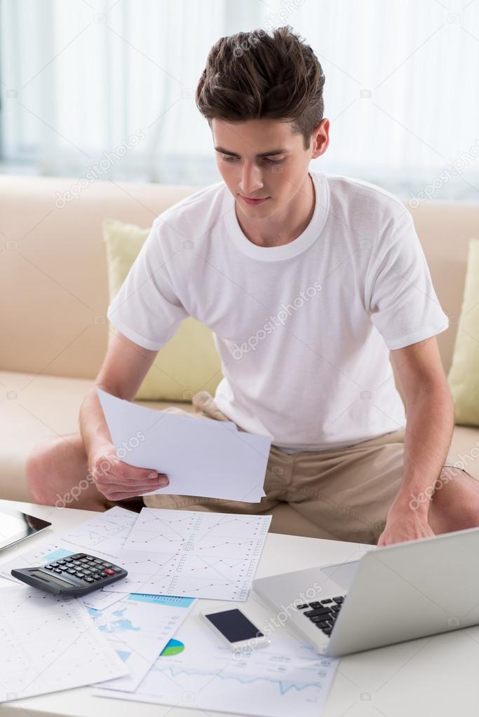 man examining business documents