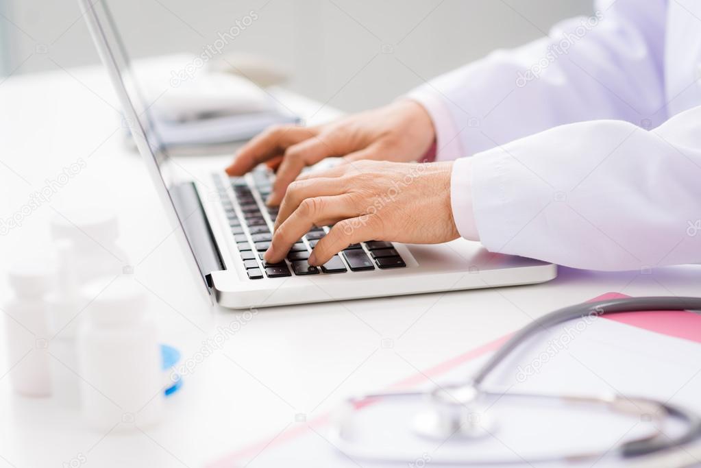 medical worker using laptop