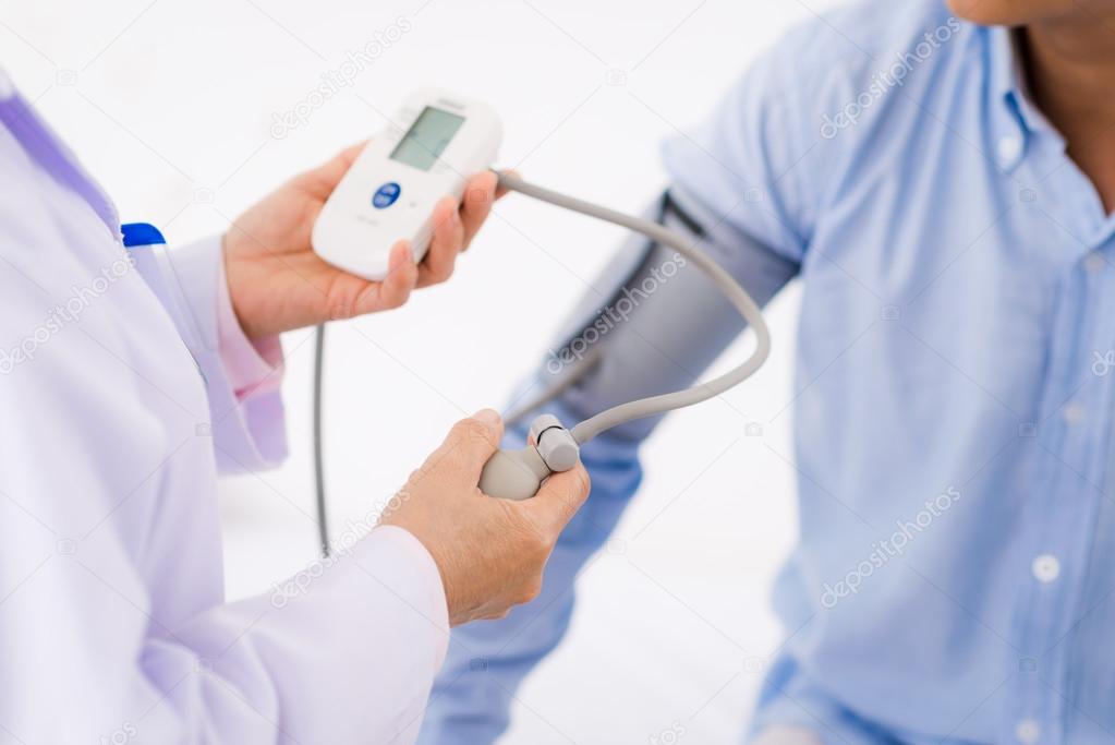 Doctor  checking blood pressure