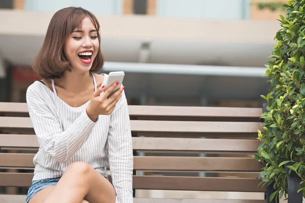 Woman reading funny message — Stock Photo, Image