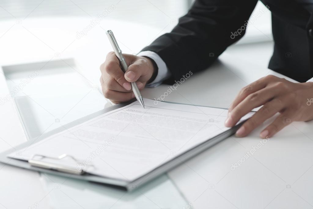 Businessman signing contrac